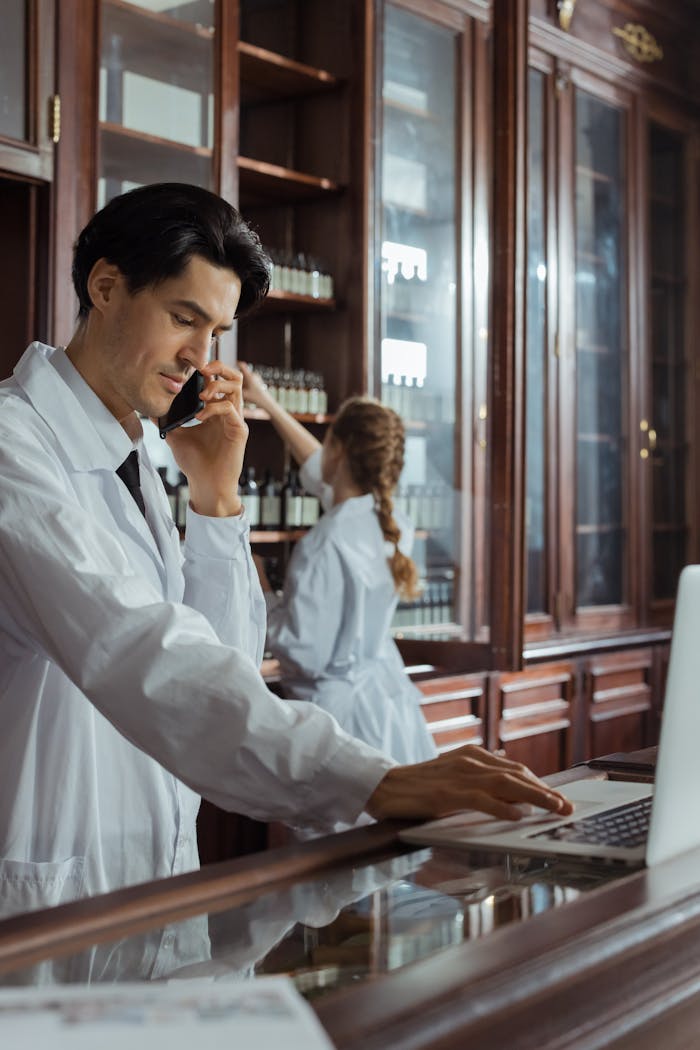 Pharmacists working in a historic pharmacy, focusing on customer calls and inventory.